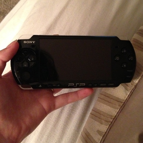 Sony PSP . Black with 4 games