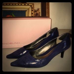 ~reduced~  navy leather pump.