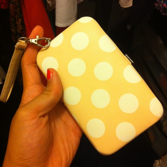 Cream polka dot iphone wristlet.