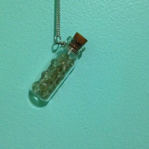 Long hanging gems in a bottle necklace.