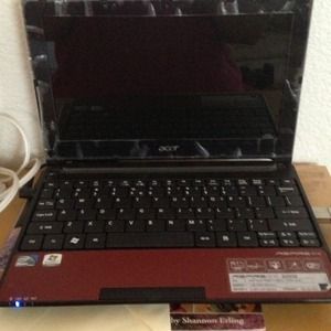 An acer mini laptop computer..