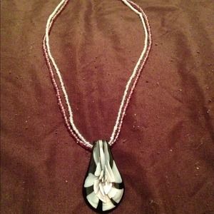 Purple flower pendant necklace.