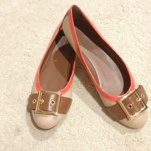 Tan flats with orange trim and gold buckle