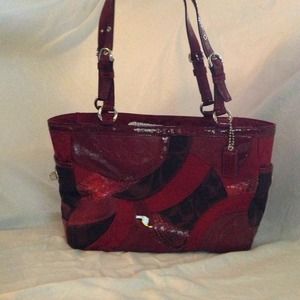 Mid size leather coach handbag.