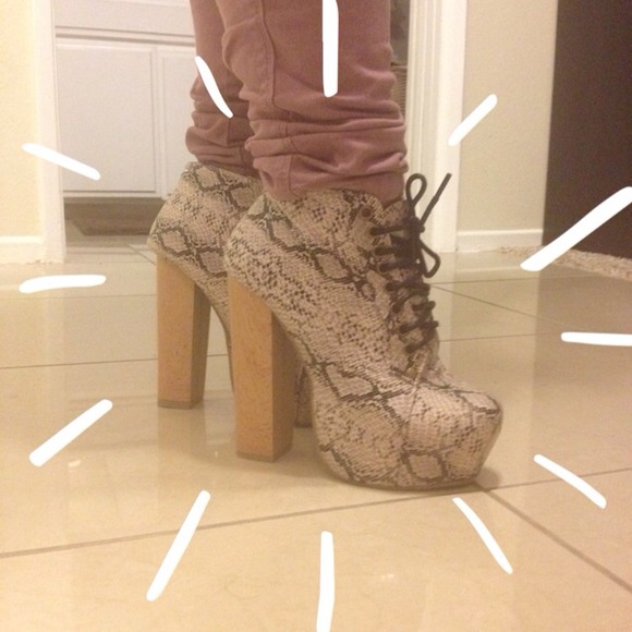 Snake patterned heel boots