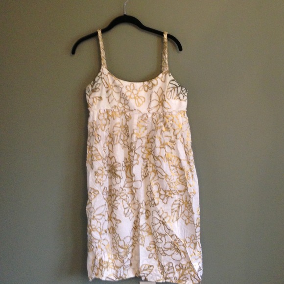 Flowy white and gold dress.