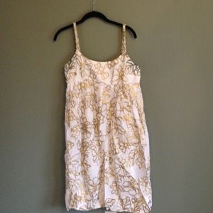 Flowy white and gold dress.