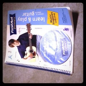 New how to play the guitar book with DVD