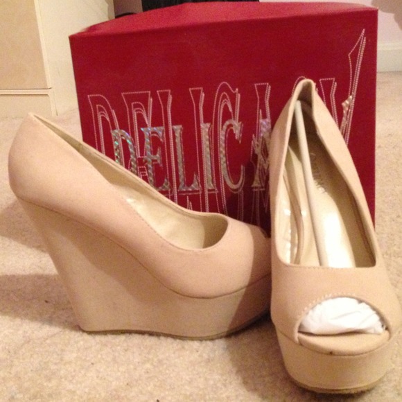 Nude wedges.