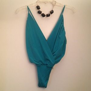Mint green body suit with crisscross back