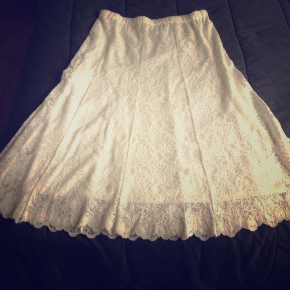 Long white lacy skirt.