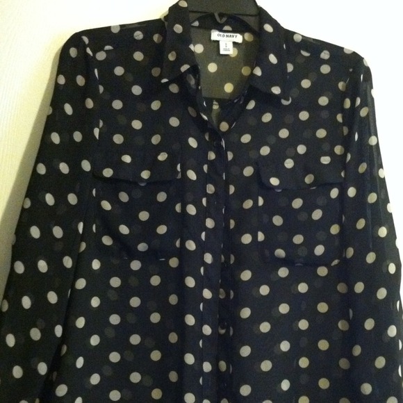 Polka-dot black shear blouse.