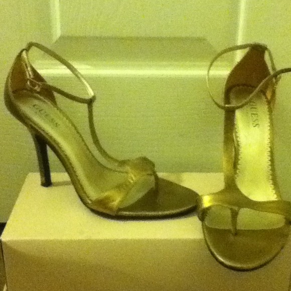Gold heels by Guess