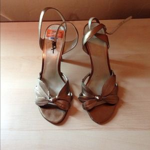Bronze sandals with leaf strap design.