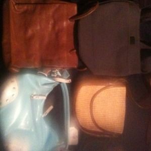 4 used bags one of them is a Nine West bag.