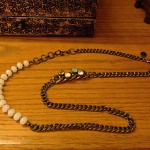 La Hola long gold chain necklace with gem stones.