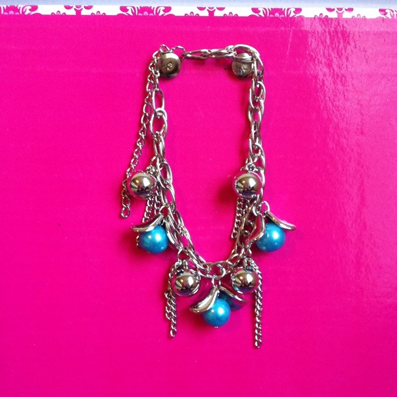 Silver bracelet with blue beads