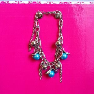 Silver bracelet with blue beads