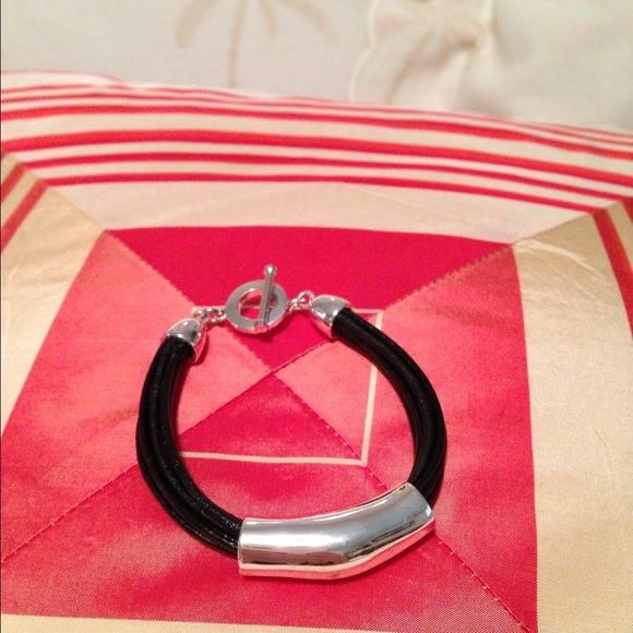 Black leather and silver tone bracelet, used.