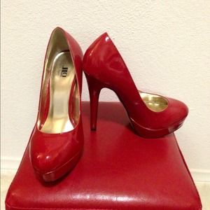 Red patent pumps