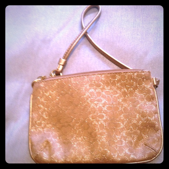 Gold coach wristlet