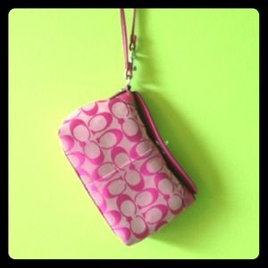Pink authentic coach wristlet.