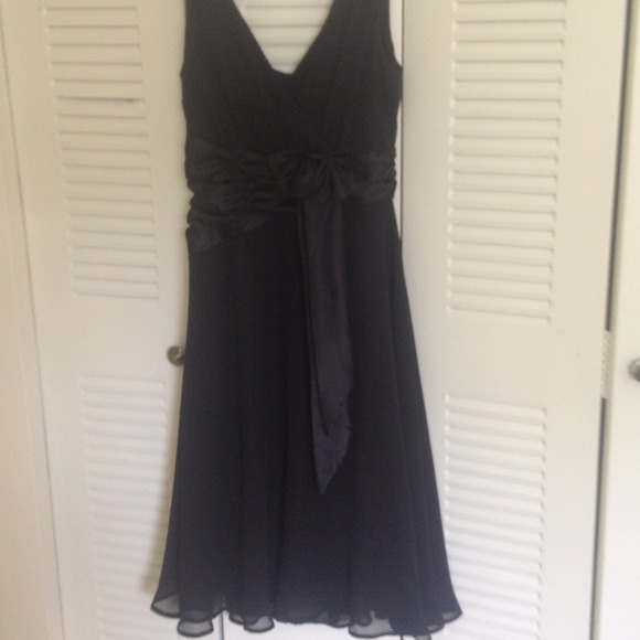 A black zip up dress with a bow