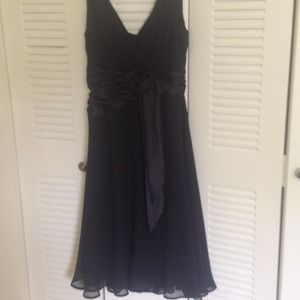 A black zip up dress with a bow