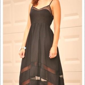 Black dress with mesh insets.