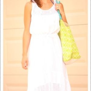 White linen dress with crochet insets.
