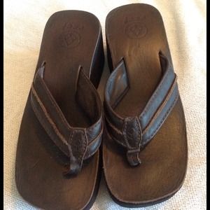 Brown REEF flip flops platform