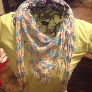 Small scarf with multicolored peace signs.