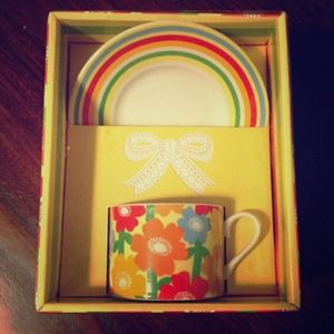 Set of cup and saucer with colored flower