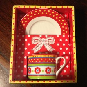 Set of cup and saucer with colored flower