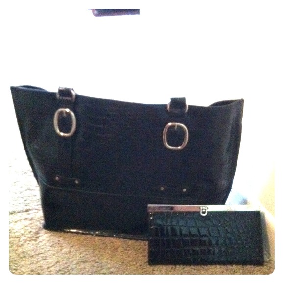 Large black leather handbag with wallet