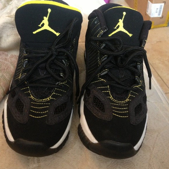 Jordan 11s. Black, white and yellow