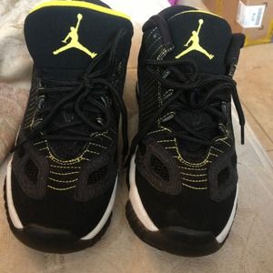 Jordan 11s. Black, white and yellow