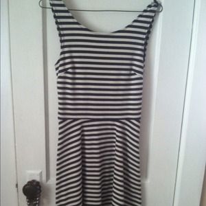form fitting dress. dark gray and white stripes