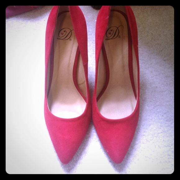 Red pointed toe high heels