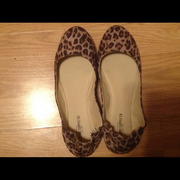 Leopard print closed toe flats.