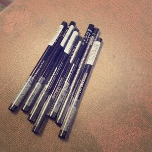 Lot of 7 avon luxury liner in black