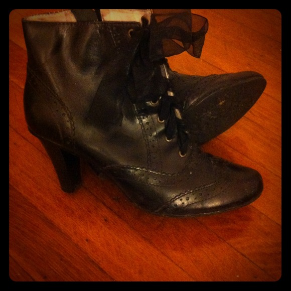 Black tie up high heeled boots