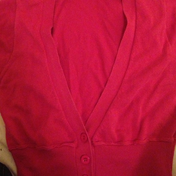 A pink short sleeved belly blouse