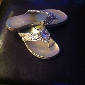 Kenneth Cole Reaction jeweled flip flops.