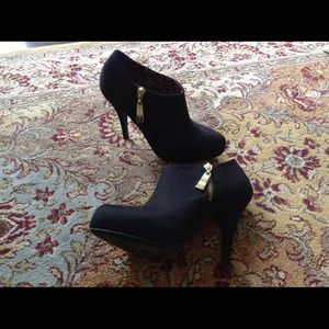Black suede booties never worn