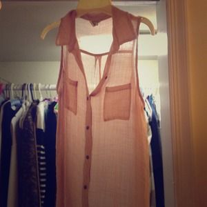 Sheer pink sleeveless shirt.