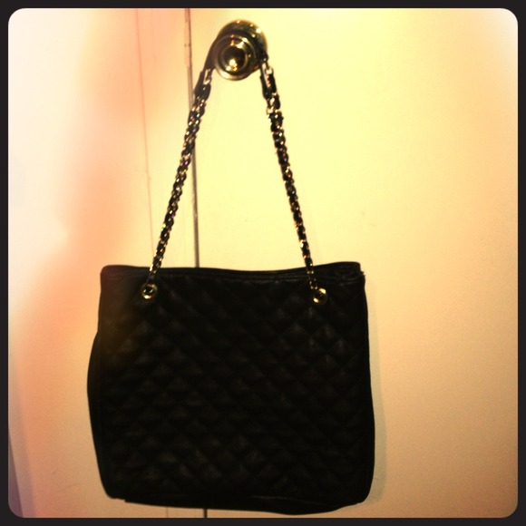 Large black quilt tote bag with gold laced straps