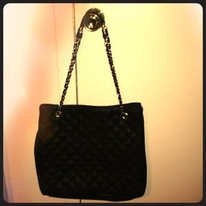 Large black quilt tote bag with gold laced straps