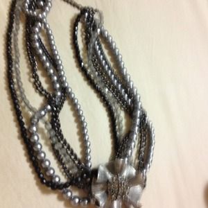 Multi strand necklace with removable broach