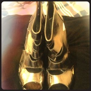 Pewter color gladiator pump. Never worn. Size 9